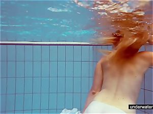 ultra-cute ginger-haired plays bare underwater