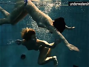 two uber-sexy amateurs flashing their figures off under water